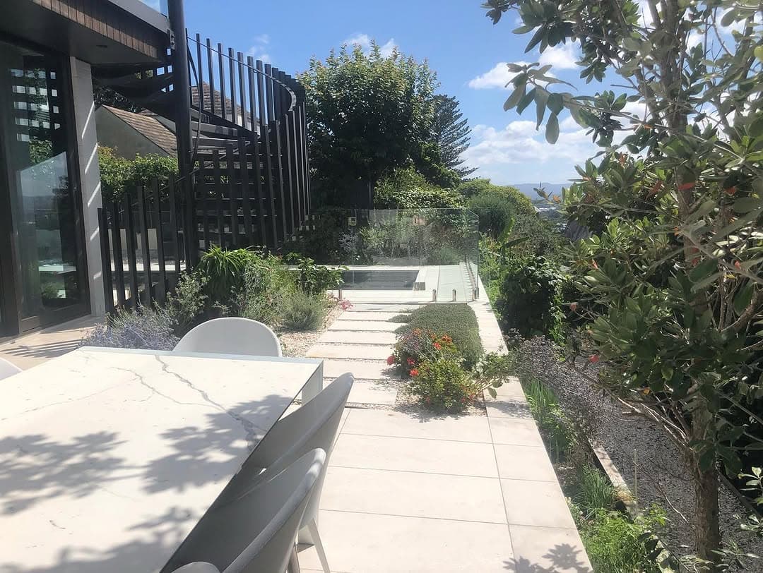 Large-format paved terrace with harbour views