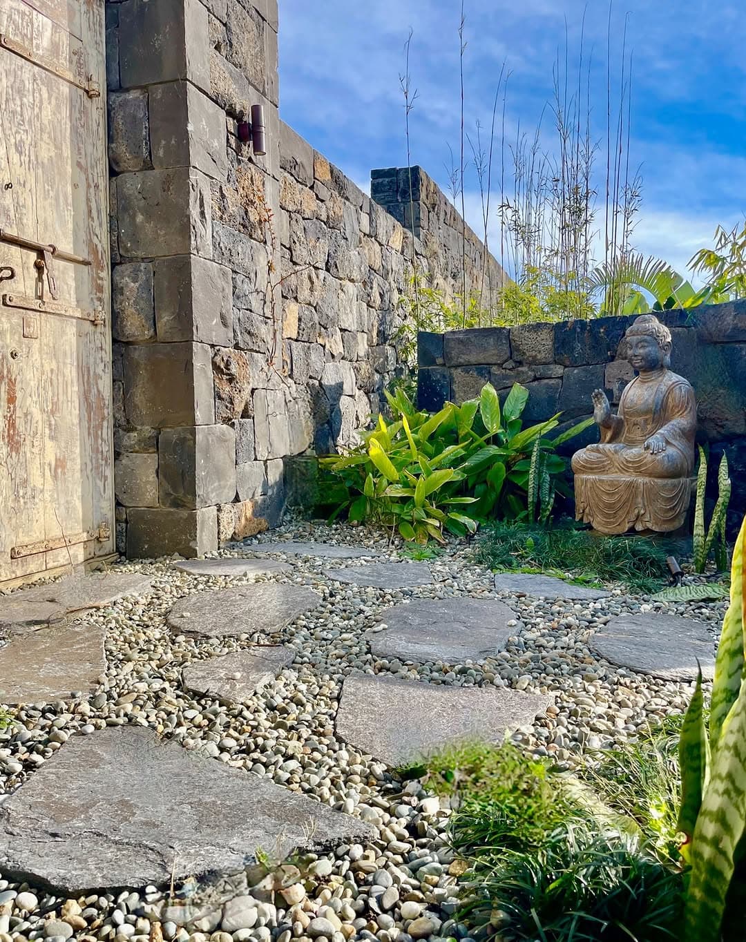 Stone stepping pavers through pebble courtyard