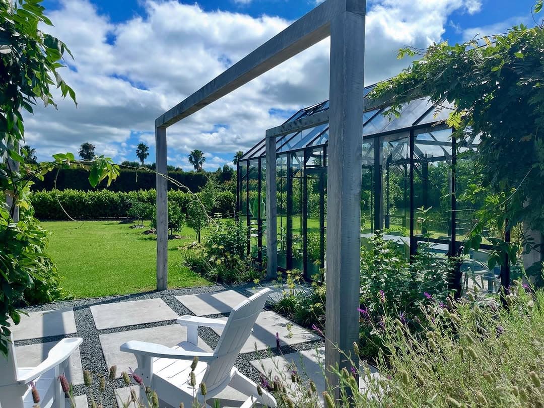 Pavers set in gravel beneath timber pergola